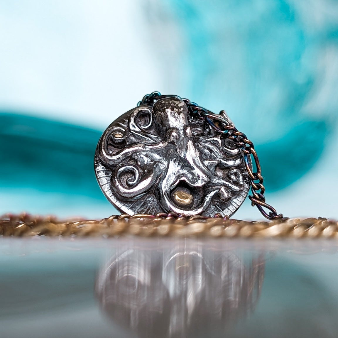 Silver circular 3D octopus necklace