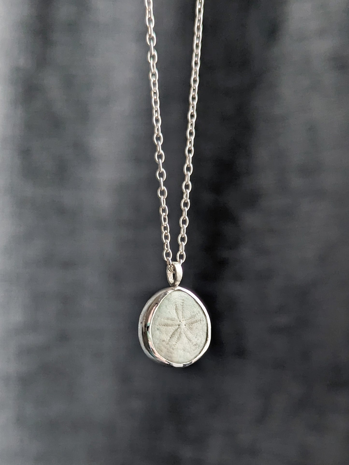 Pale green tiny seashell pendant