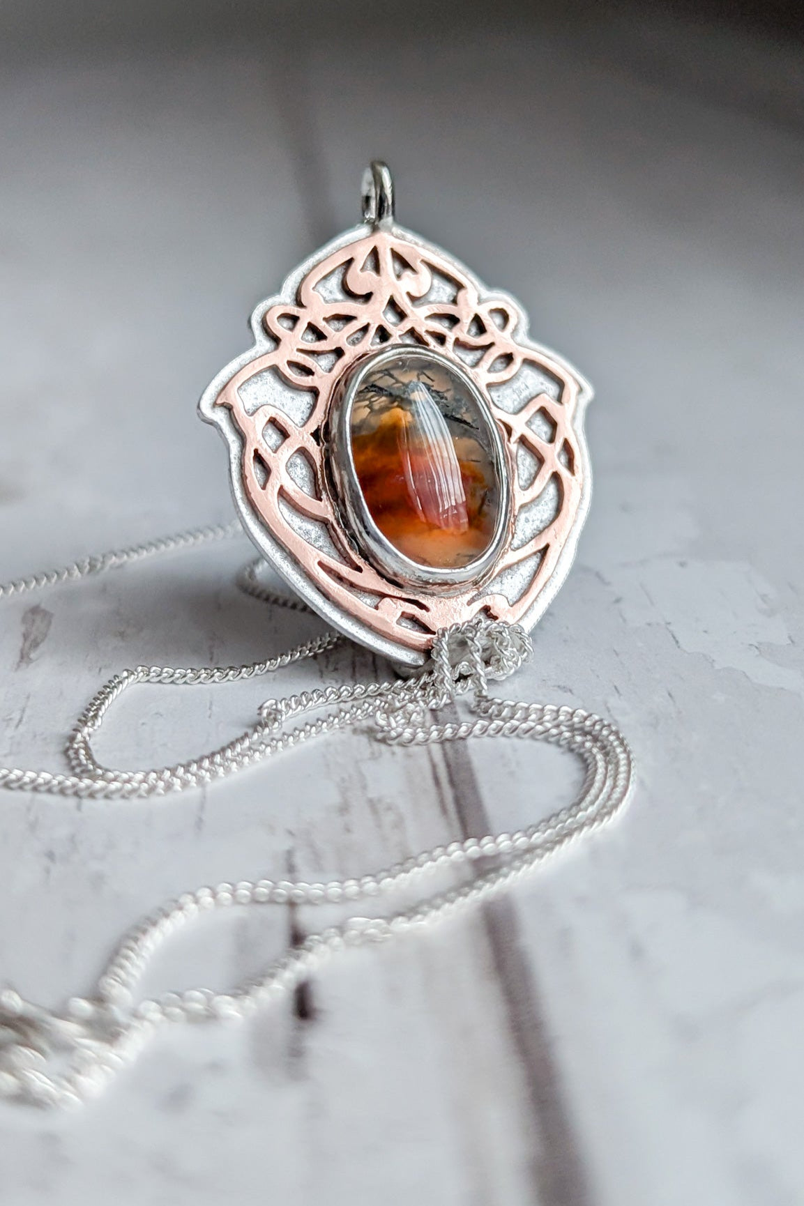 Orange mossy agate stone in a Celtic inspired viking knot pendant