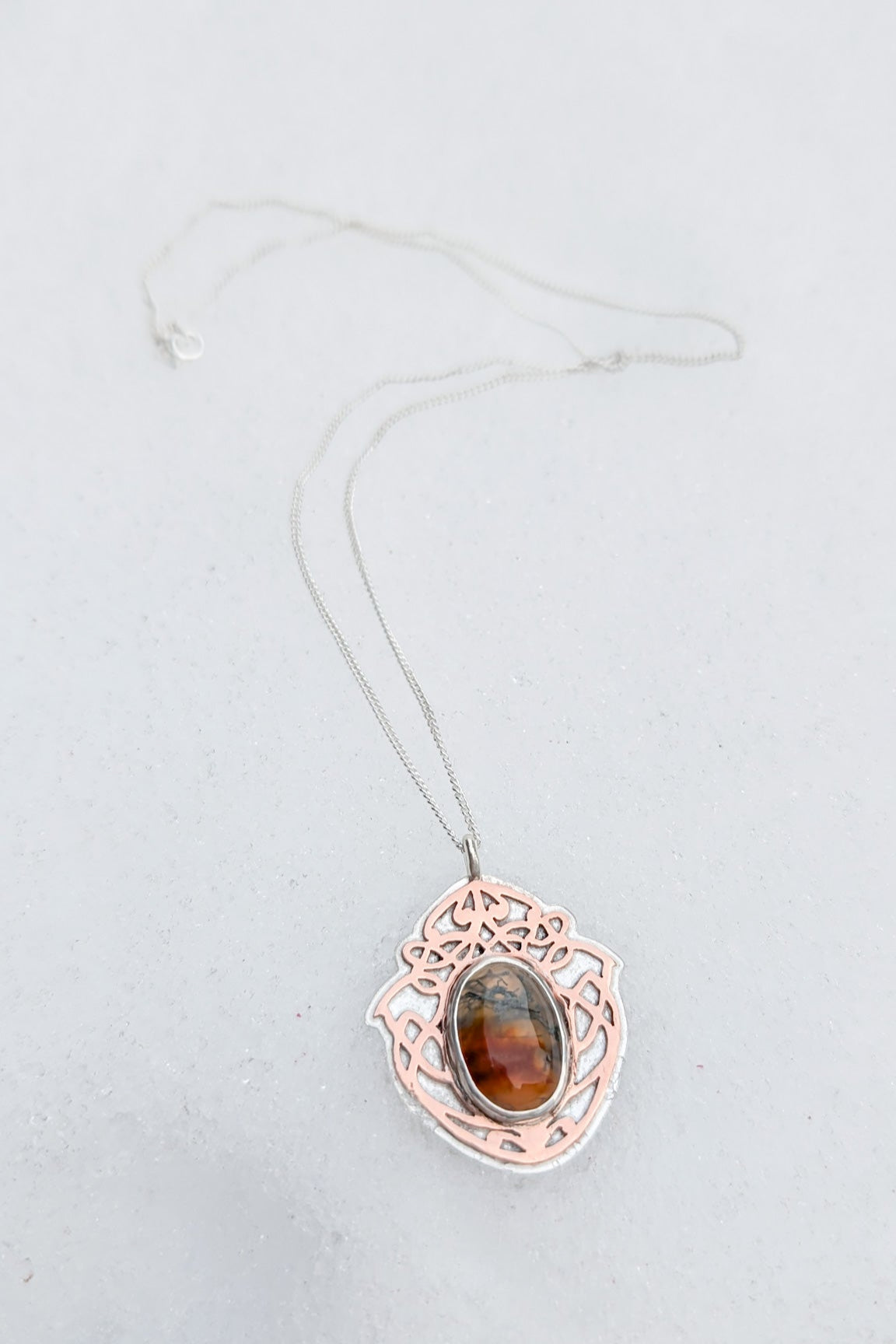 Oval moss agate stone set in an Outlander style Scottish pendant