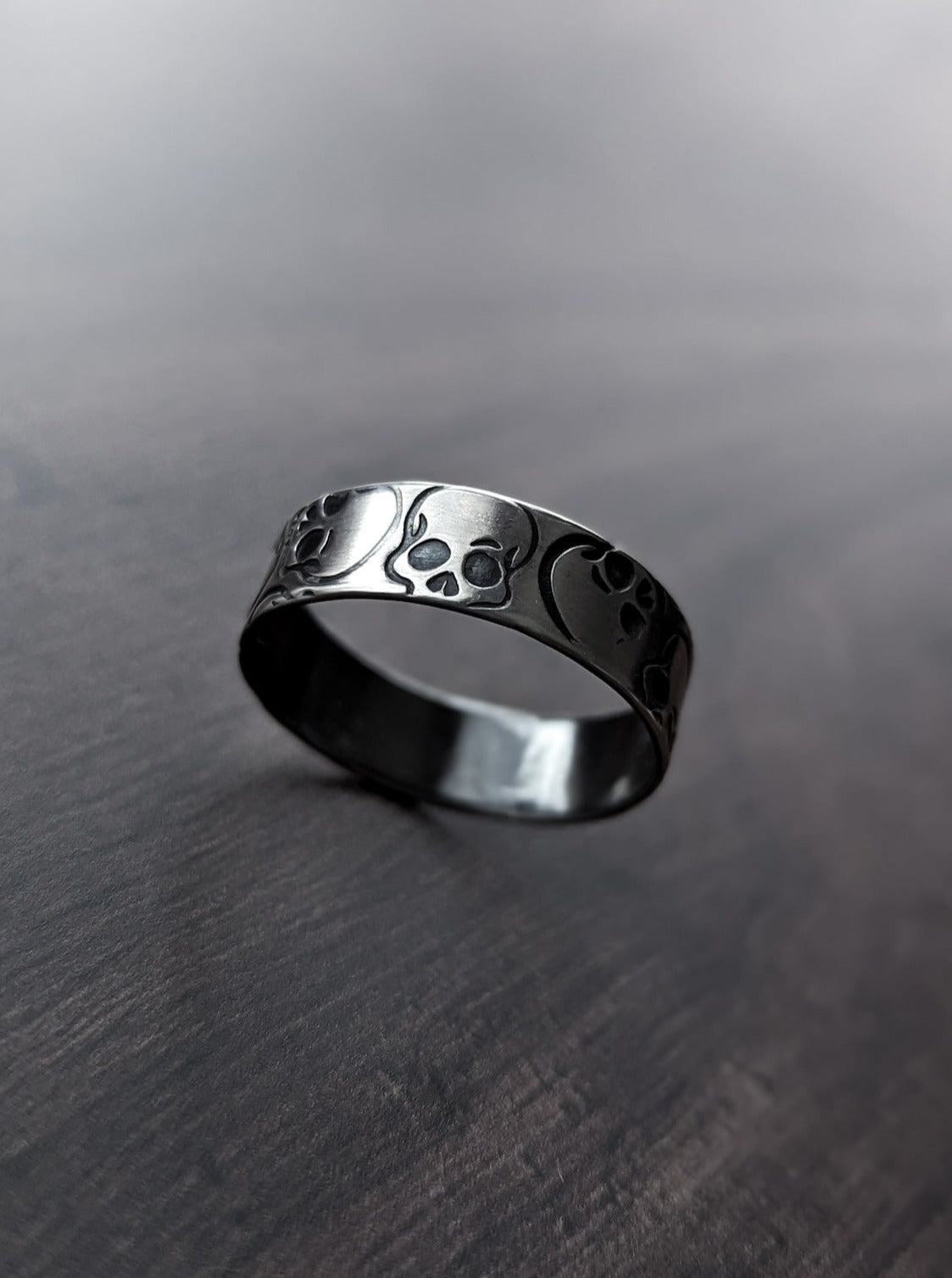 Unique alternative wedding band with skulls