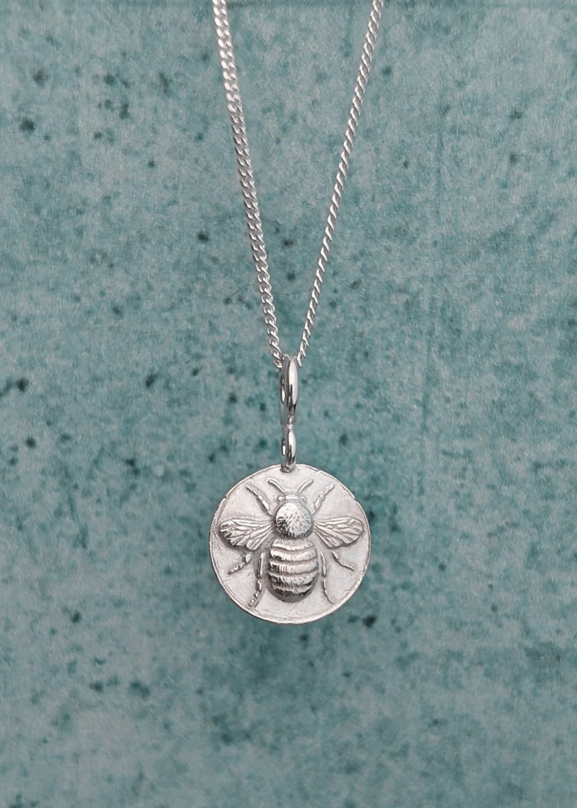 Solid silver circle bee charm