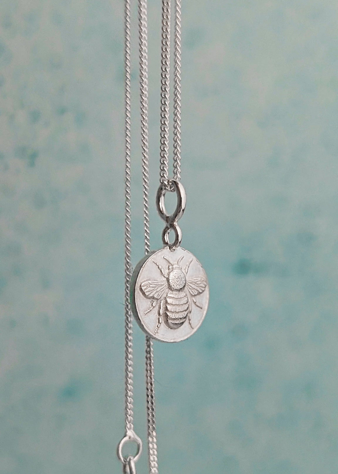 Tiny silver bumble bee necklace