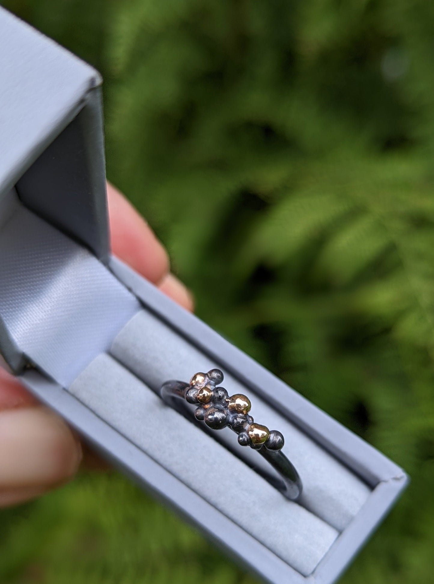 Silver and gold granulation ring in gift box