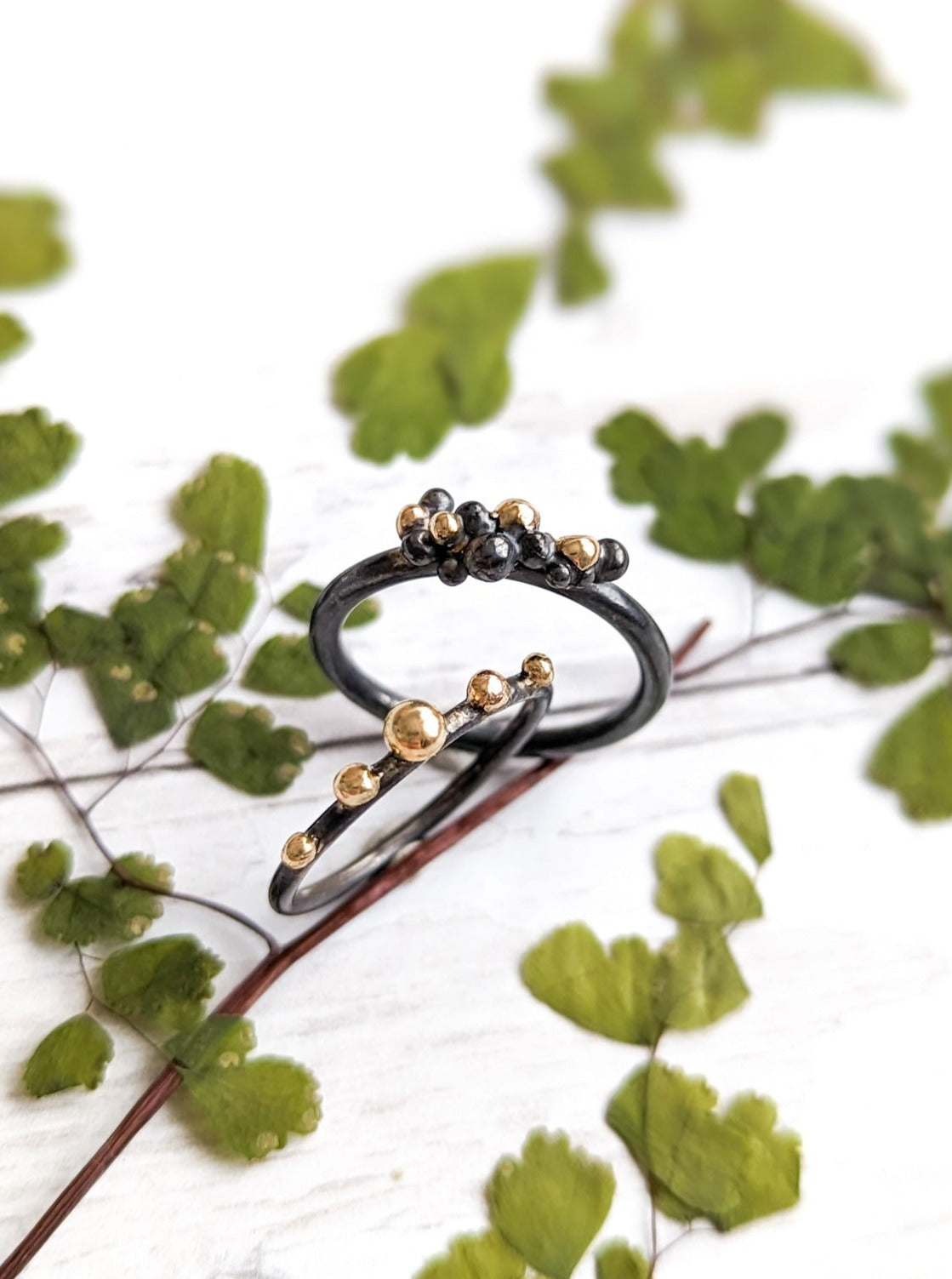 Darkened silver grunge rings with gold granulation