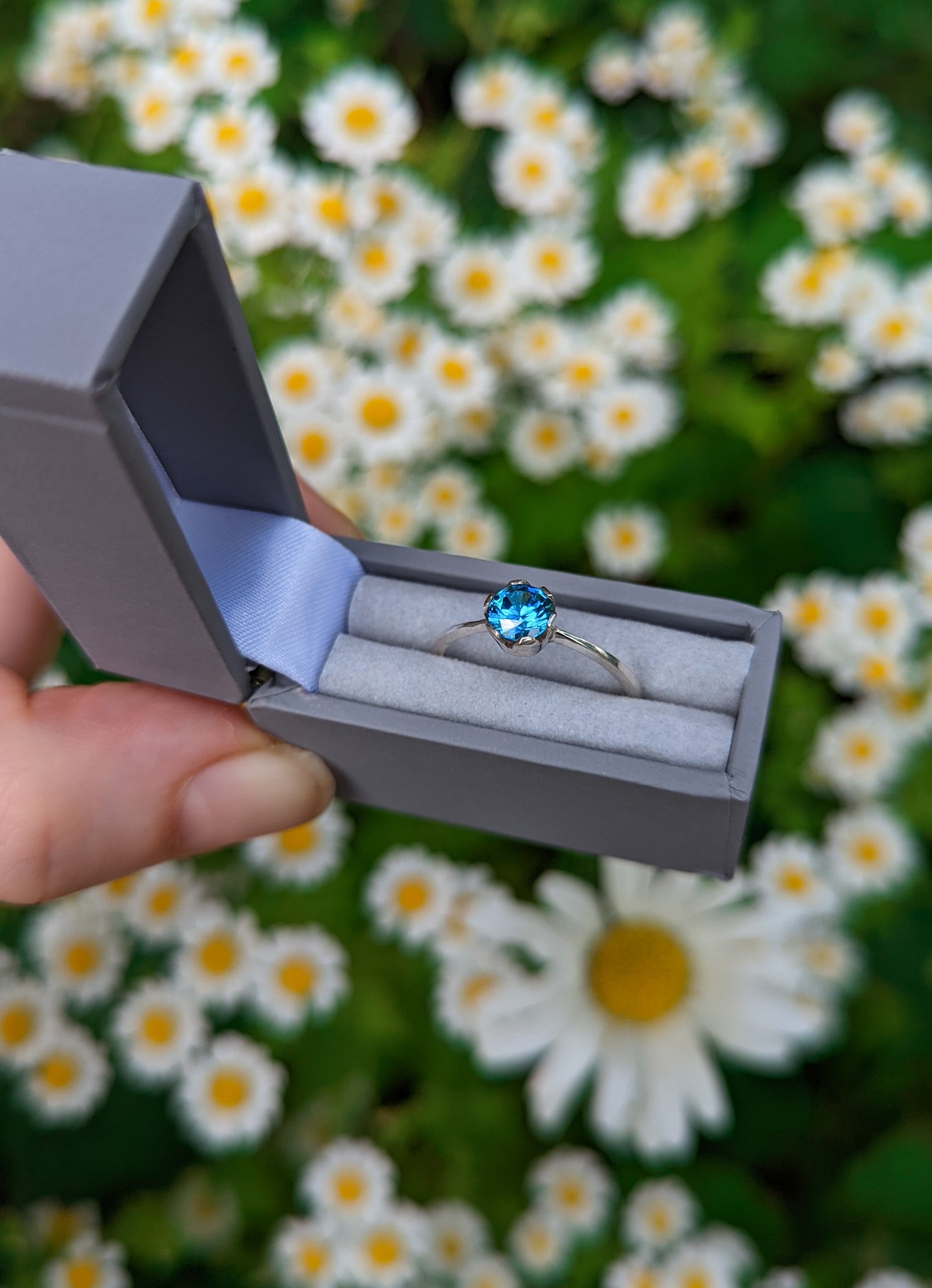 Vibrant blue solitaire ring UK size P