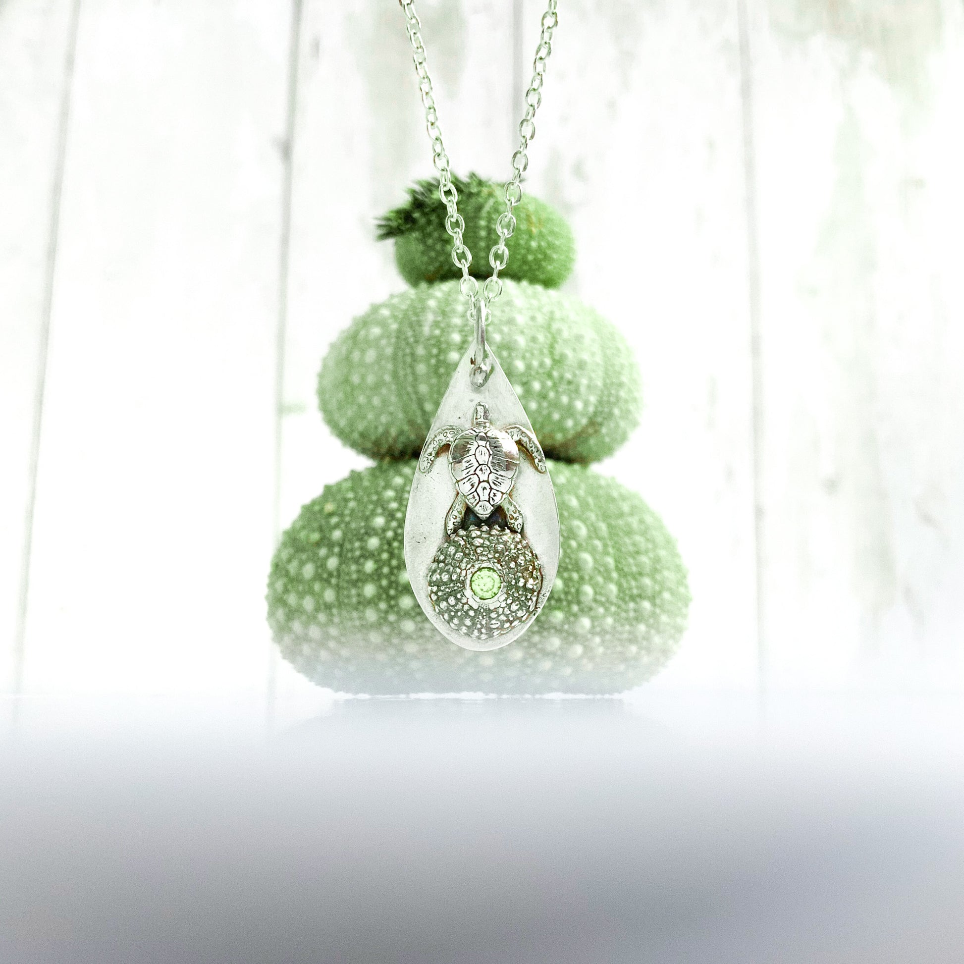 Real silver sea turtle necklace with urchin shell