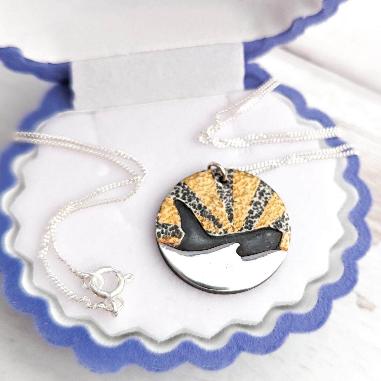Gold and silver orca silhouette necklace
