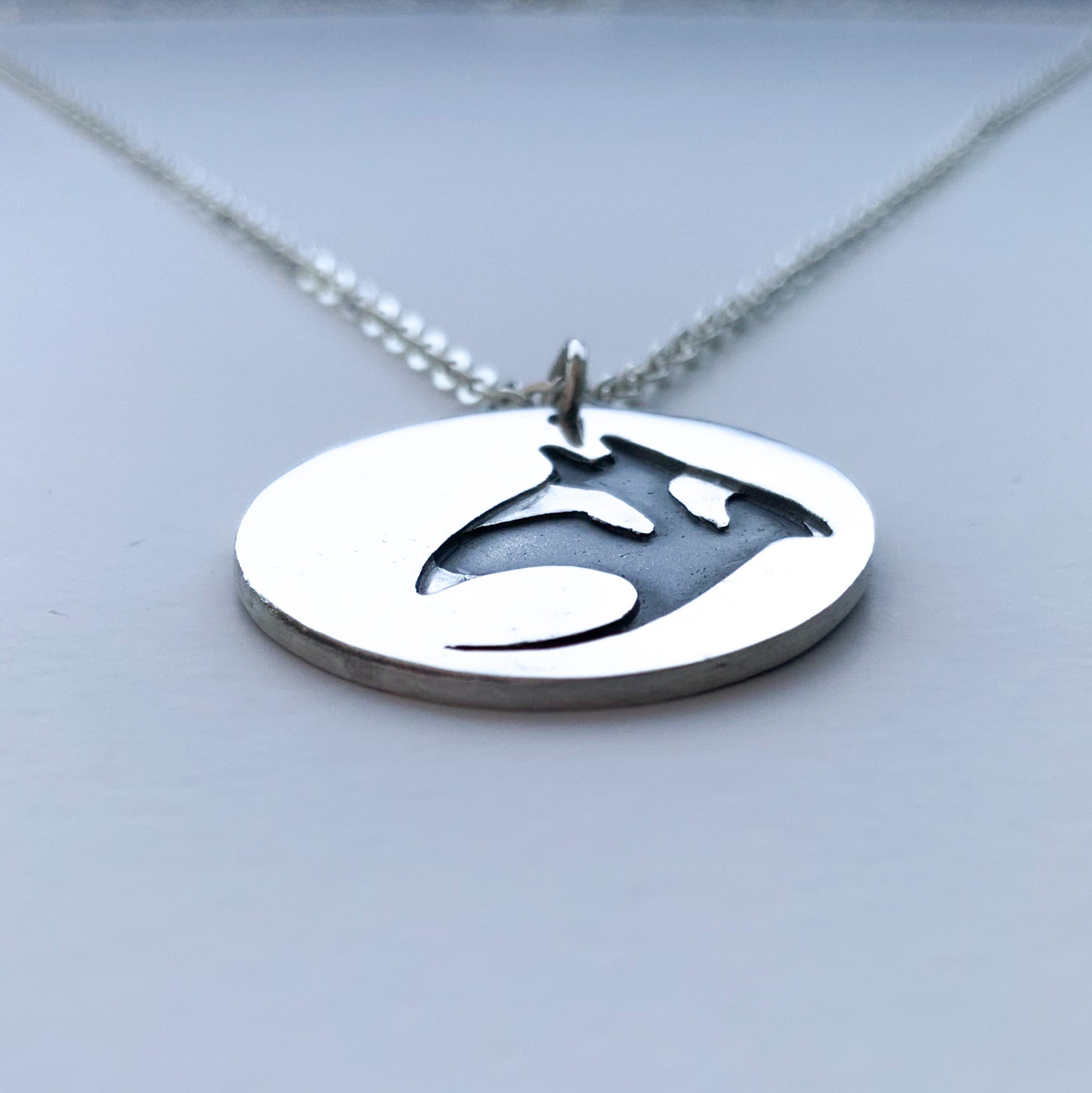 Solid silver disc manta ray necklace