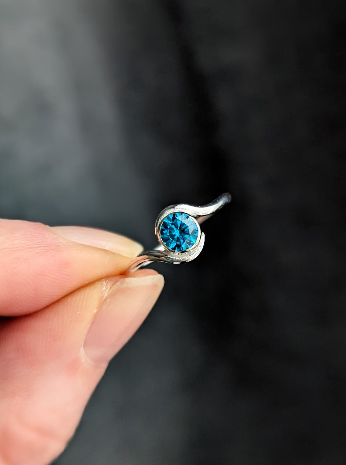 Vibrant blue engagement ring for beach wedding
