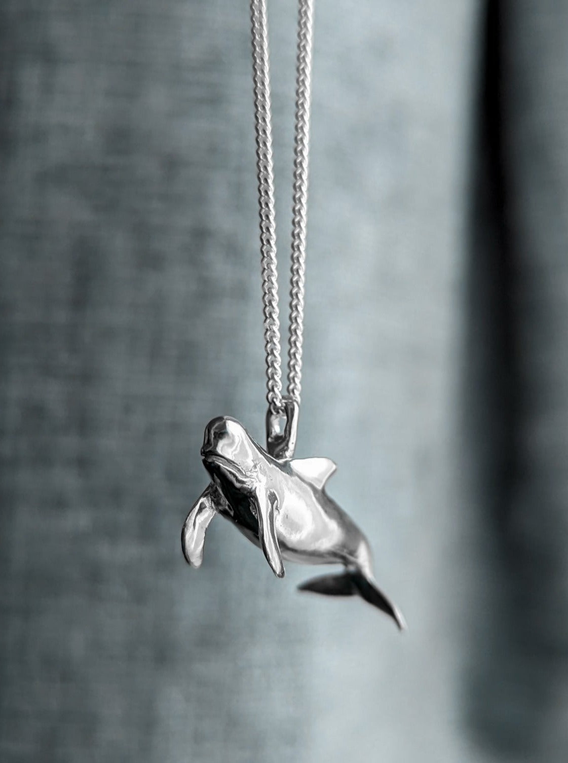 Realistic silver pilot whale pendant