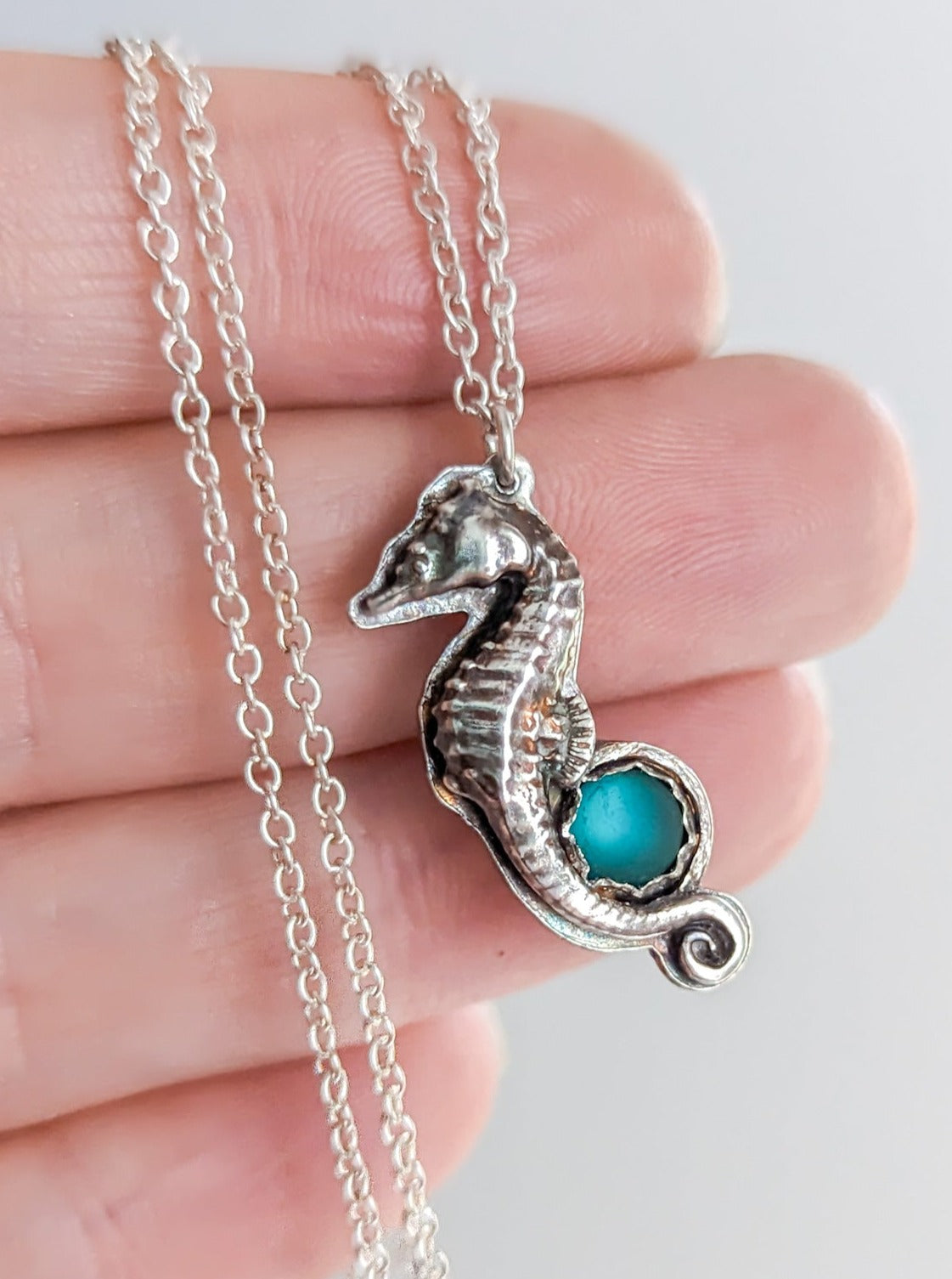 Petite silver seahorse necklace with turquoise stone