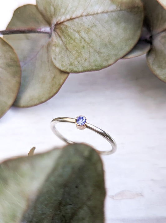 Silver and gold blue stone solitaire ring