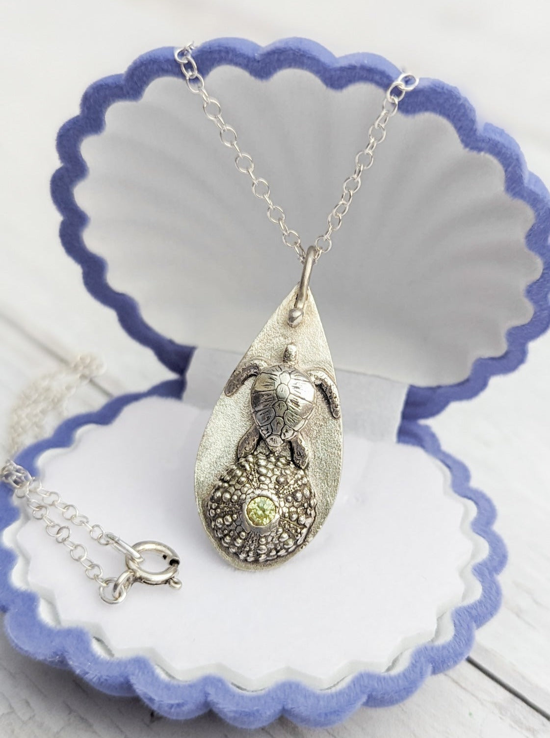 Teadrop pendant with sea turtle and sea urchin shell