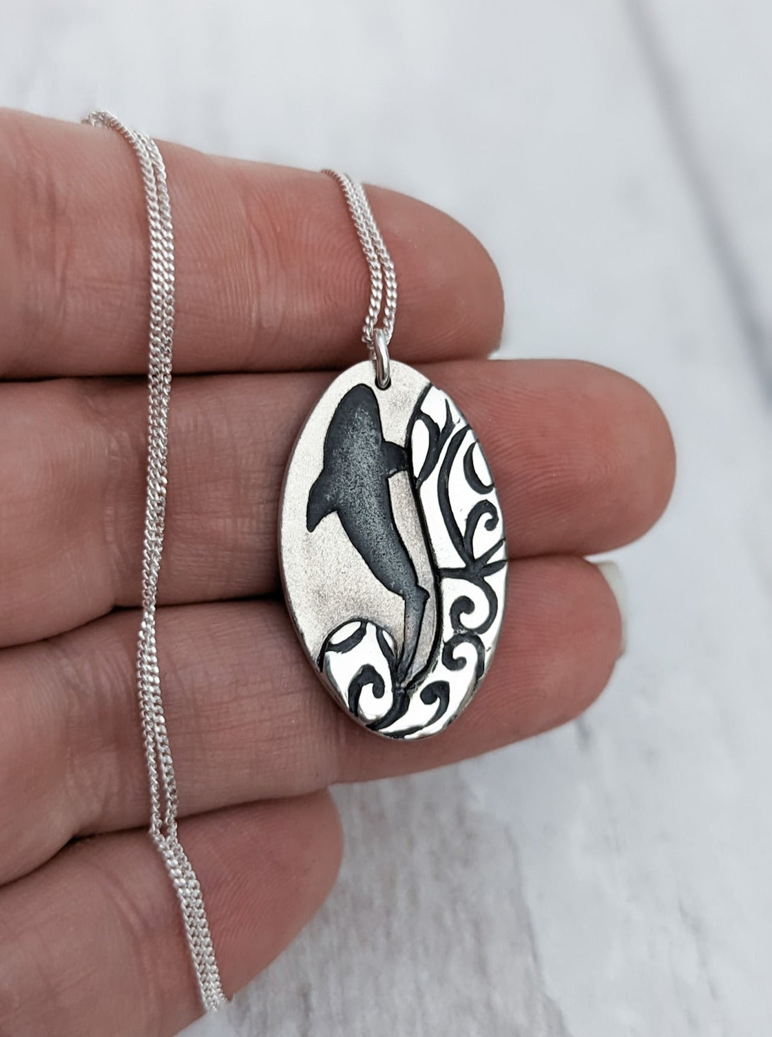 Silver shark silhouette necklace