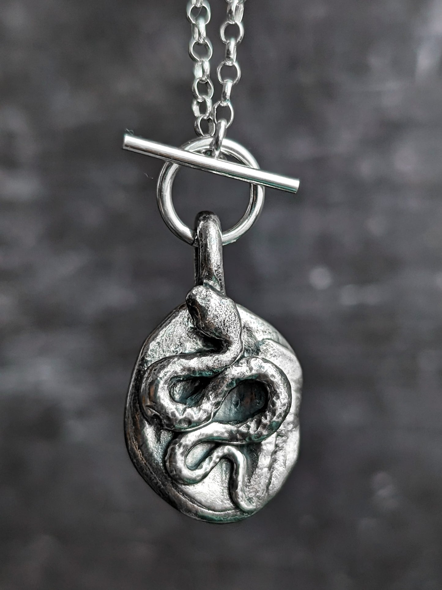 Solid silver serpent pendant