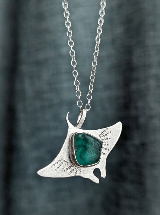 Stamped silver manta ray necklace with teal sea glass