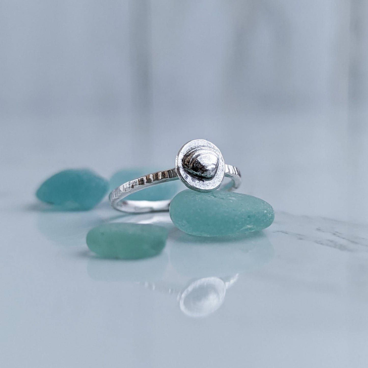 Tiny silver clam shell ring