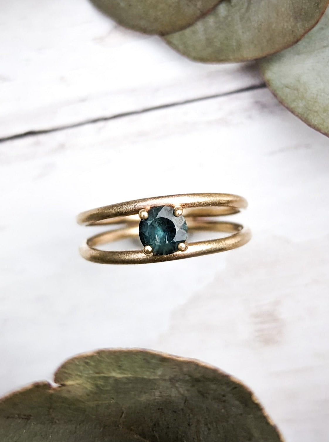 Stunning alternative engagement ring with teal sapphire