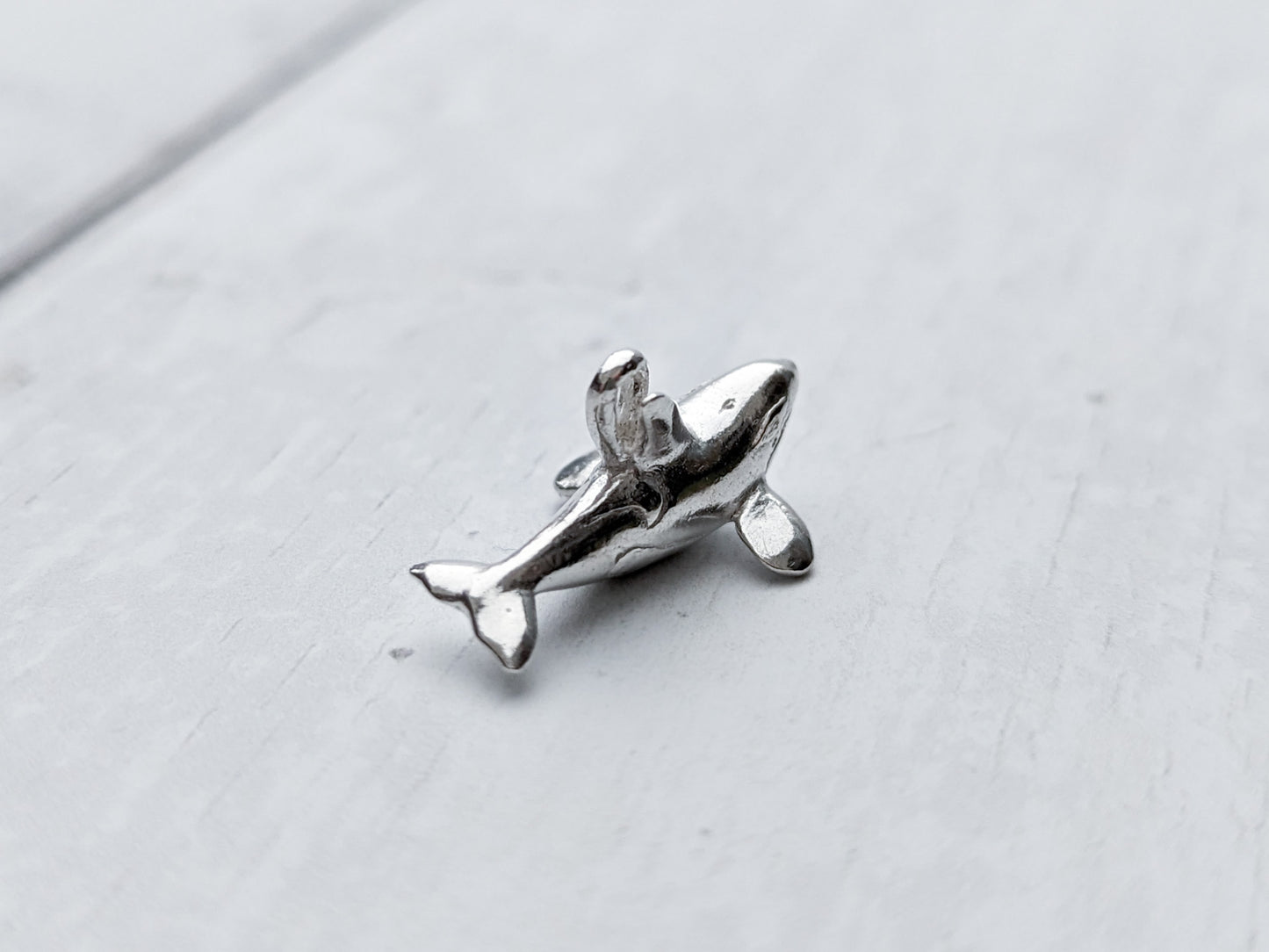 Tiny silver orca charm