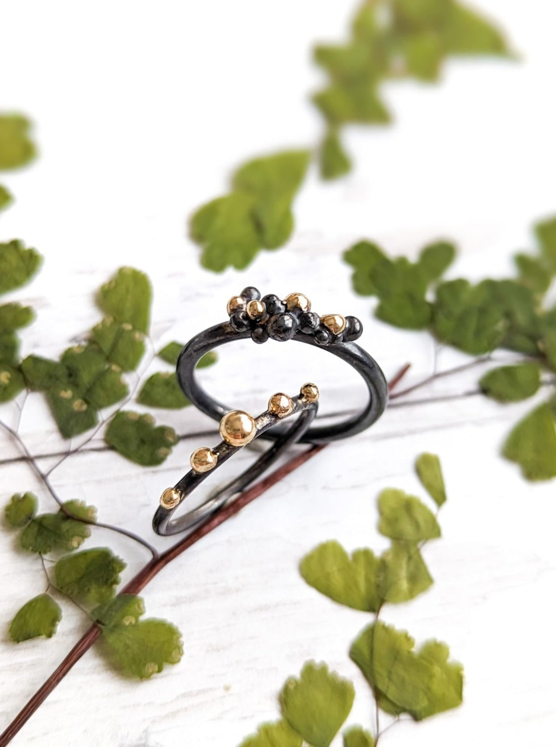 Darkened silver and gold granulation rings