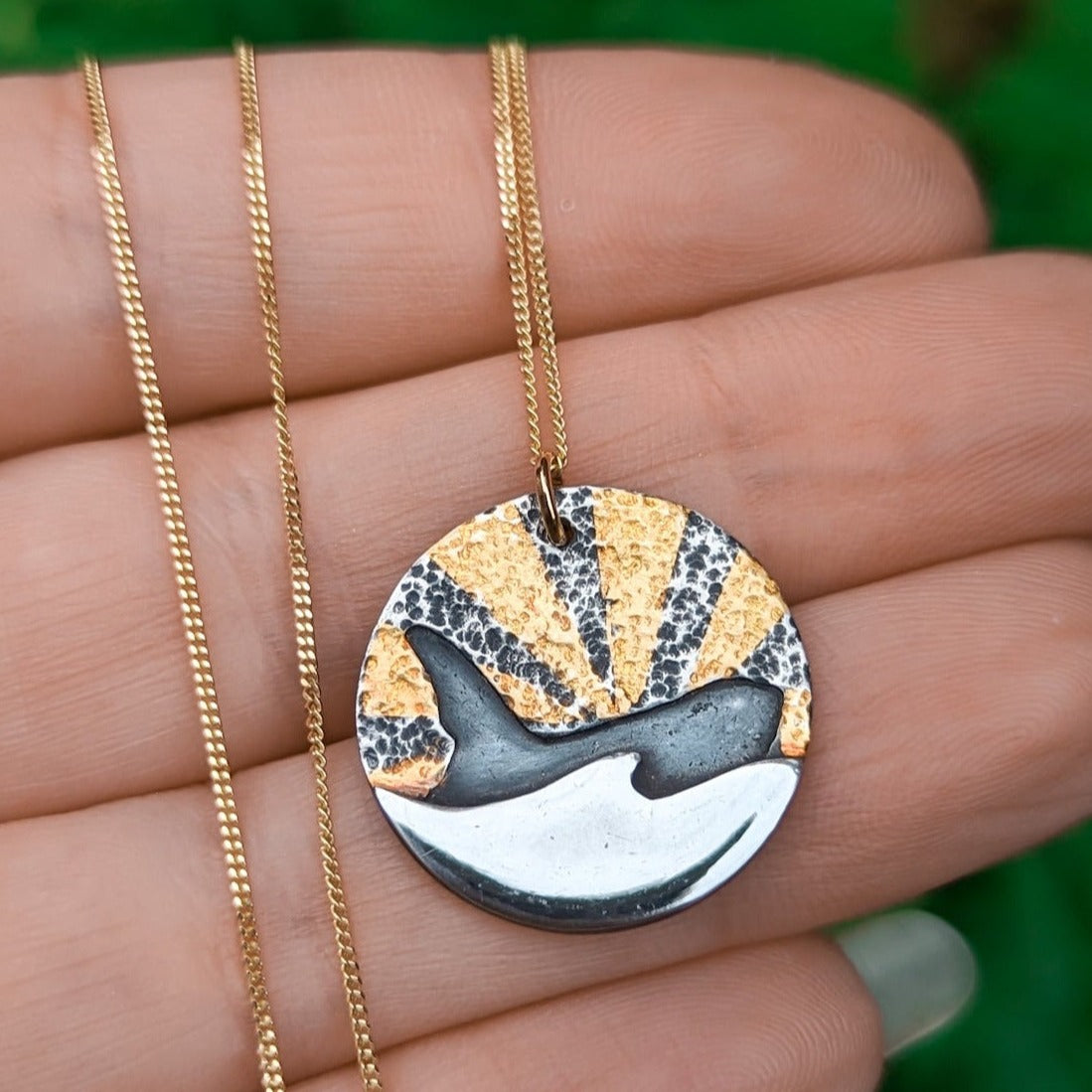 Gold and silver killer whale pendant