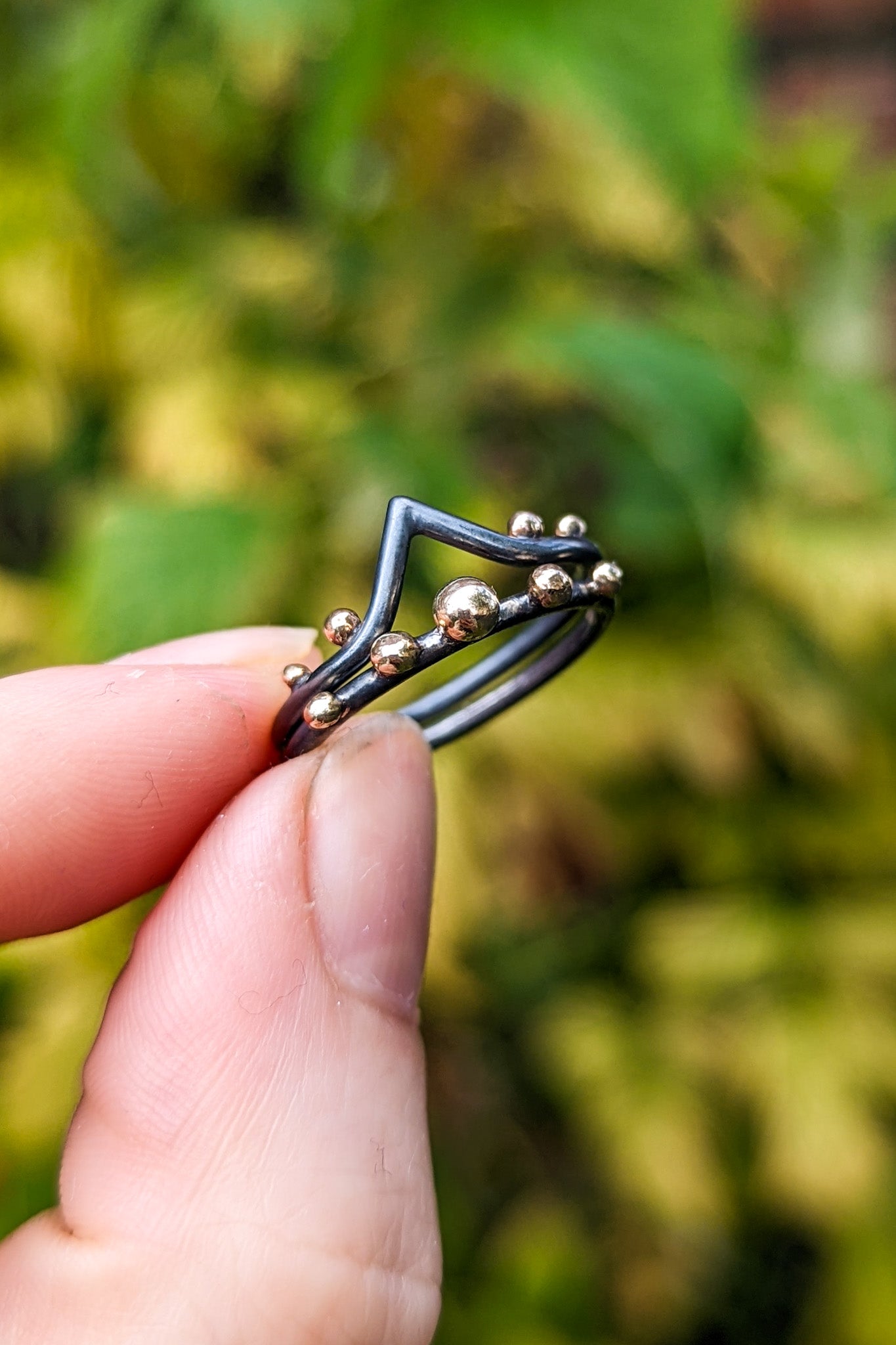 Darkened silver and gold granulation ring stack