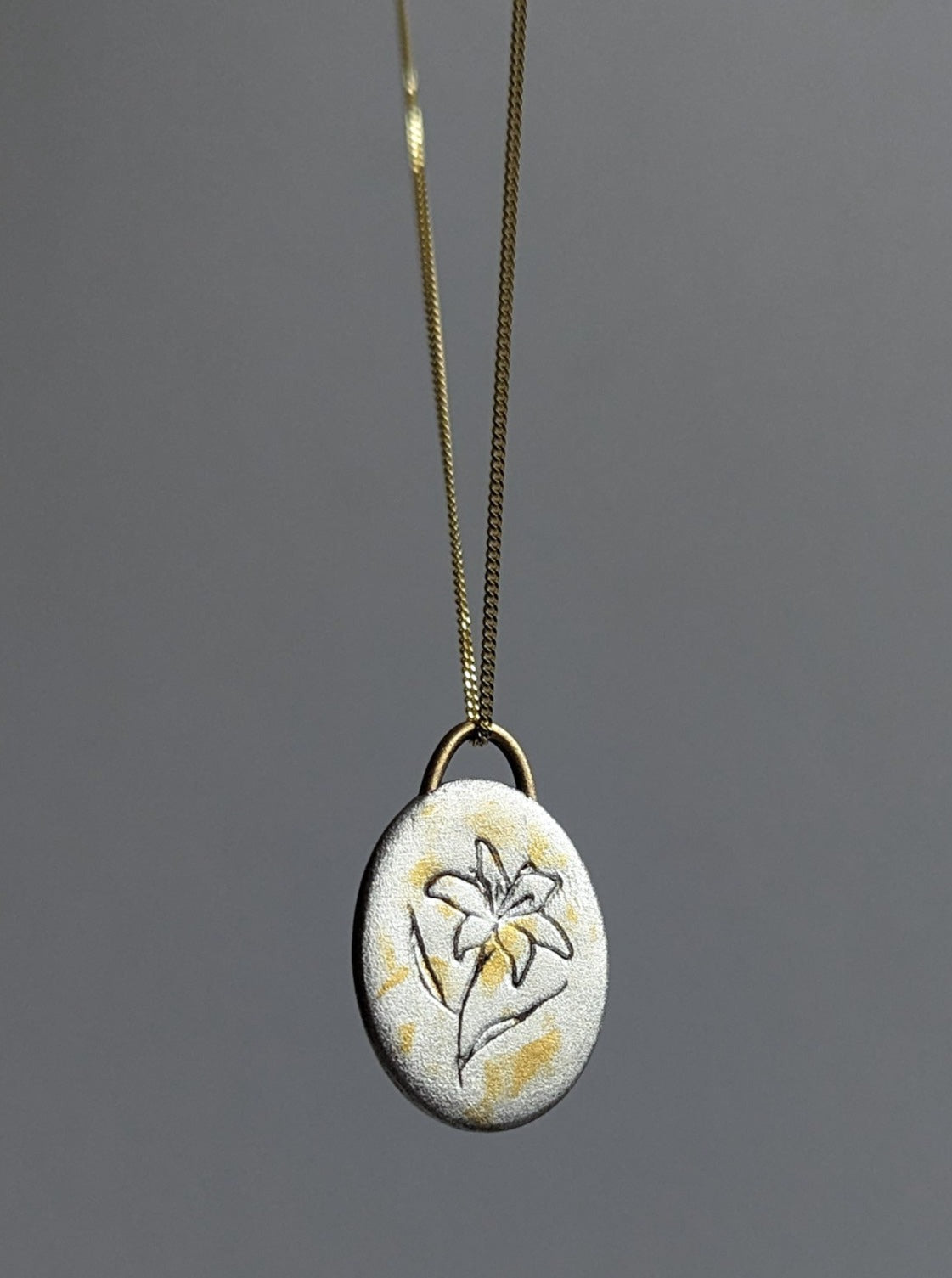 Silver and gold lily flower pendant