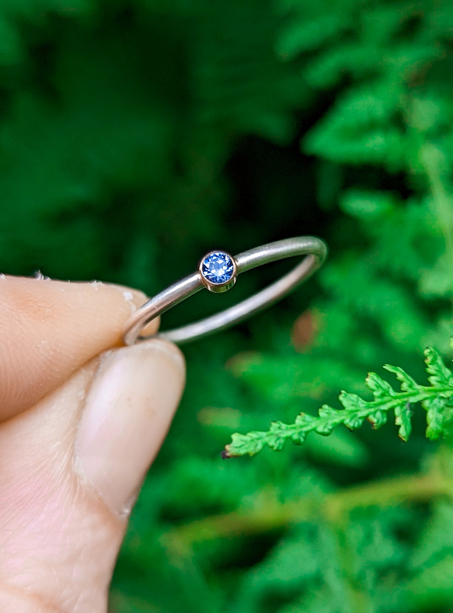 Navy blue brilliant cut solitaire ring