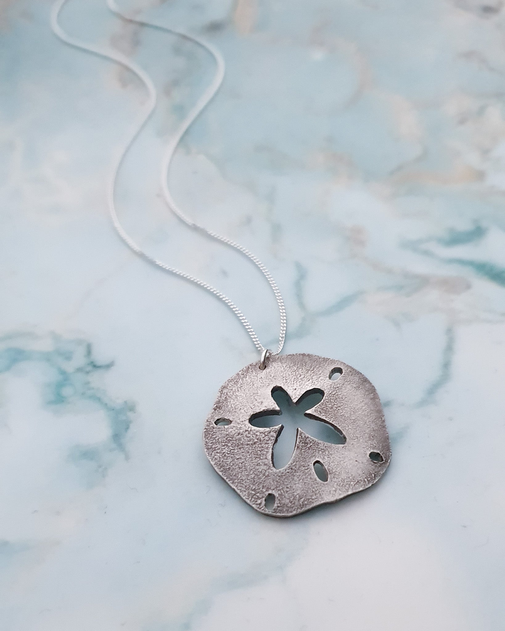 Recycled silver sand dollar necklace