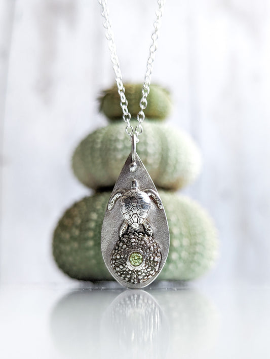 Solid silver sea turtle and urchin necklace