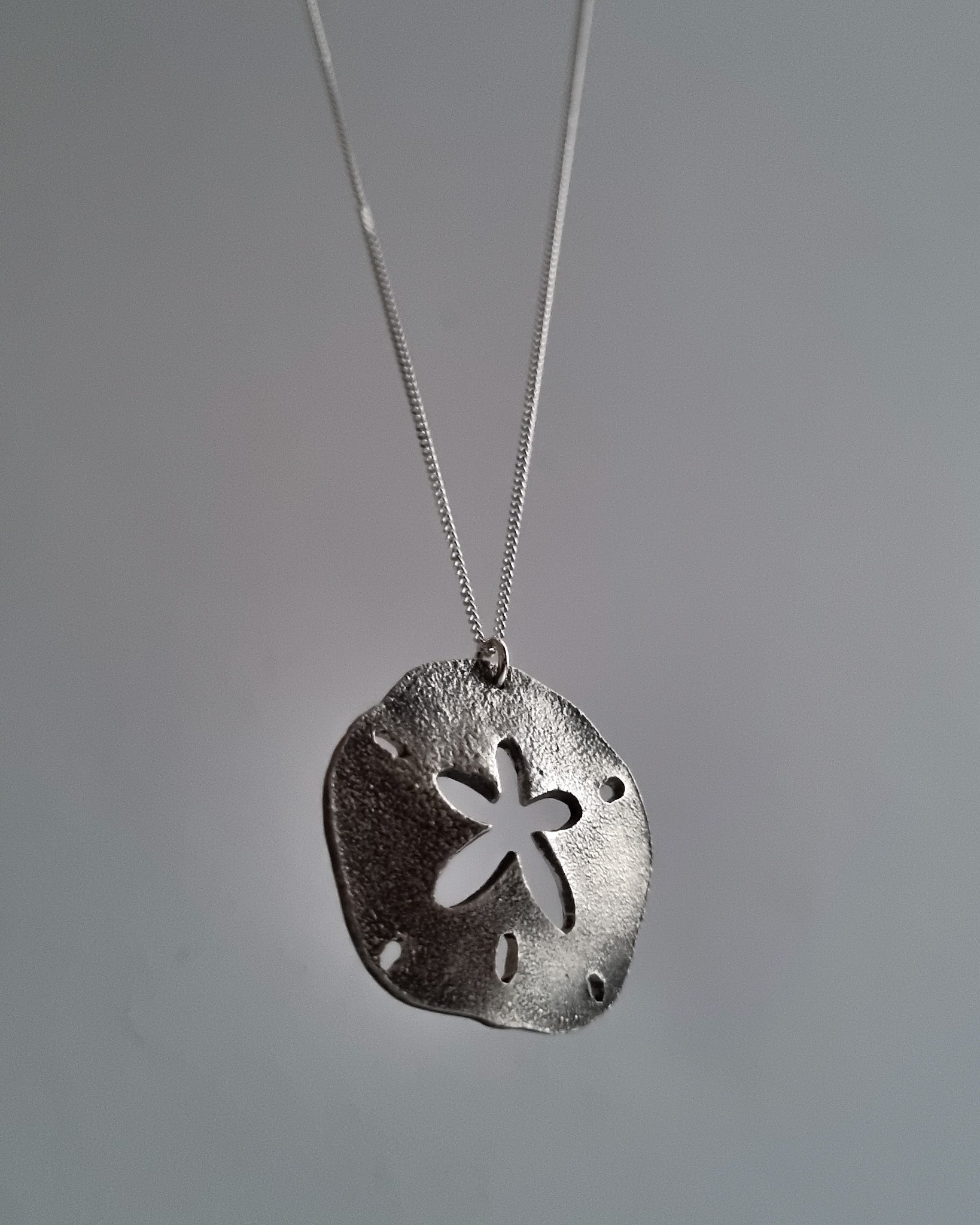 Sterling silver sand dollar pendant